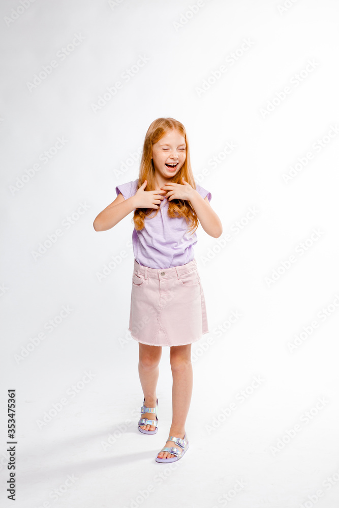 cute red-haired girl in casual clothes smiling cute red-haired girl in casual clothes smiling