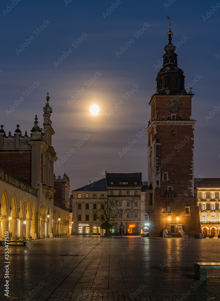 Naklejka premium Krakow, Poland, main square night view with full moon