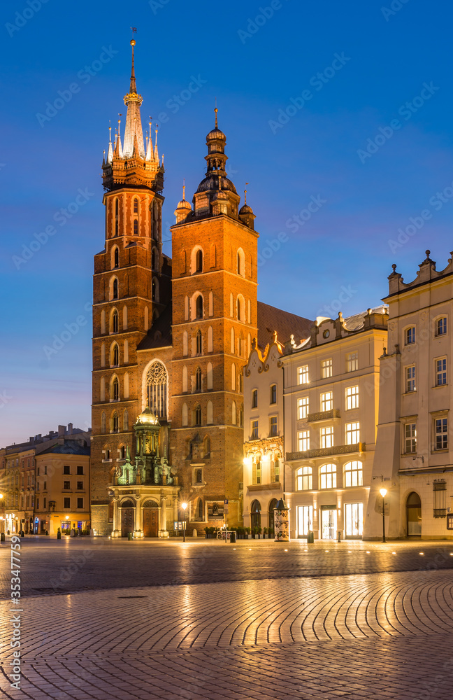 Main market square, St Mary's church in the night, Krakow, Poland