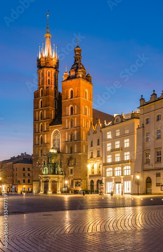 Main market square, St Mary's church in the night, Krakow, Poland