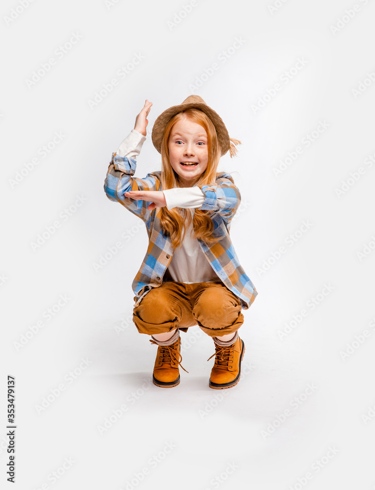 cute long-haired emotional girl in traveler clothes squats cute long-haired emotional girl in traveler clothes squats