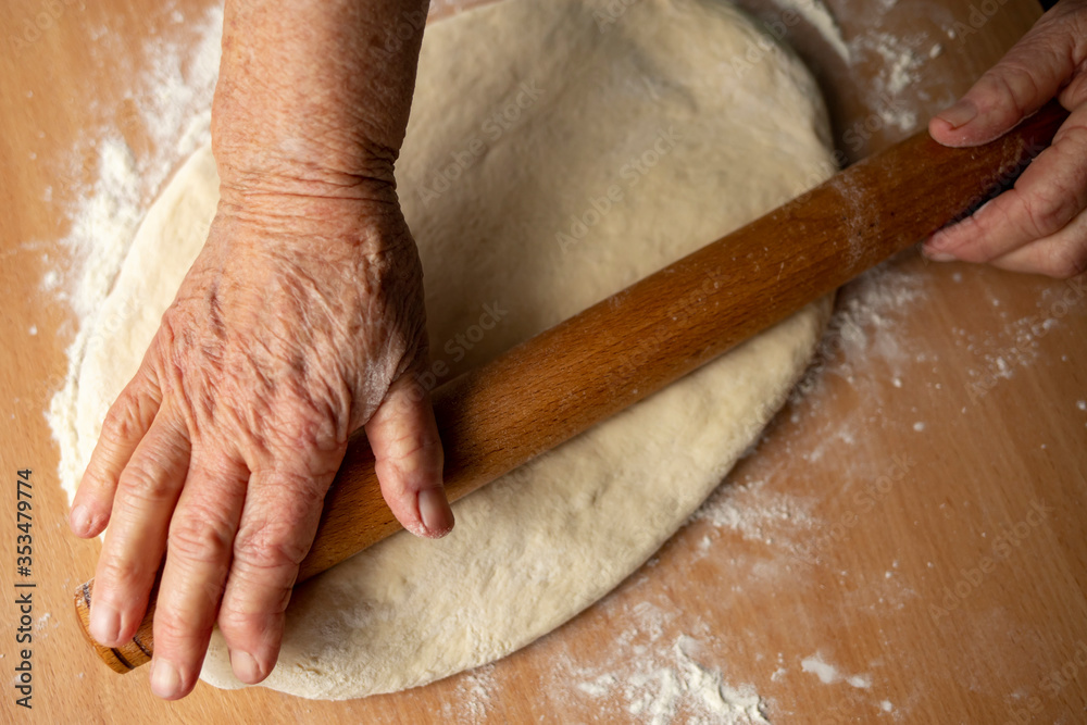 Grandmother's hands close-up prepare homemade dough. Grandmother's hands close-up prepare homemade dough.