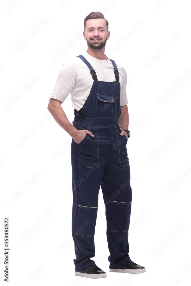 side view. smiling man in overalls looking forward to copy space side view. smiling man in overalls looking forward to copy space