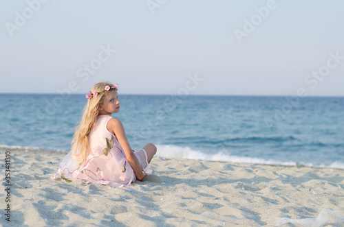 little child sitting back view alone by the sea © katarinagondova
