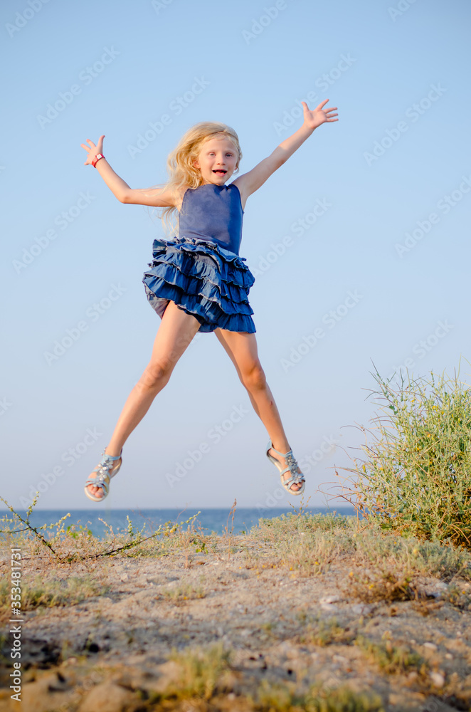 cute little girl jumping up and screaming in sunny day cute little girl jumping up and screaming in sunny day