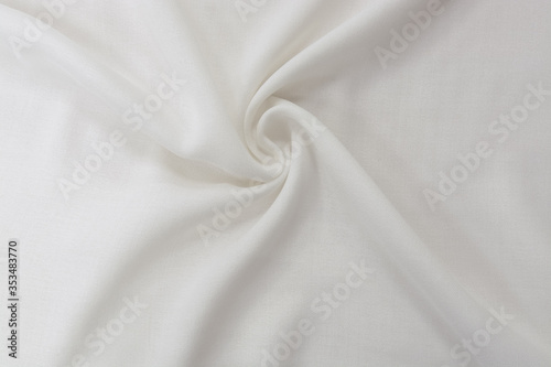 Texture of cool polyester fabric. Background of white textile