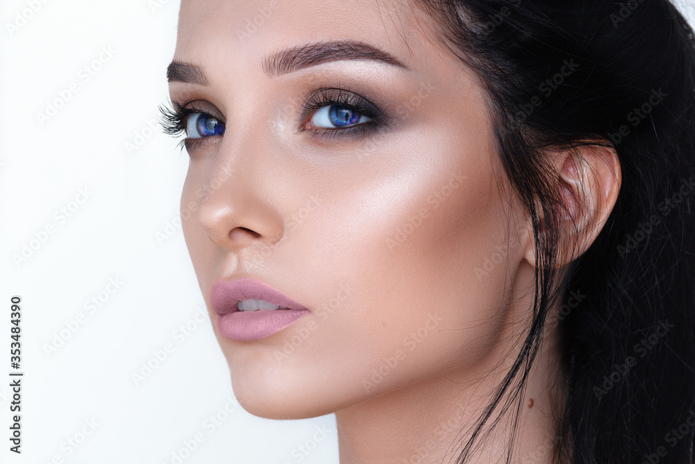 Fototapeta premium a beauty brunette woman portrait, blue vampire eyes