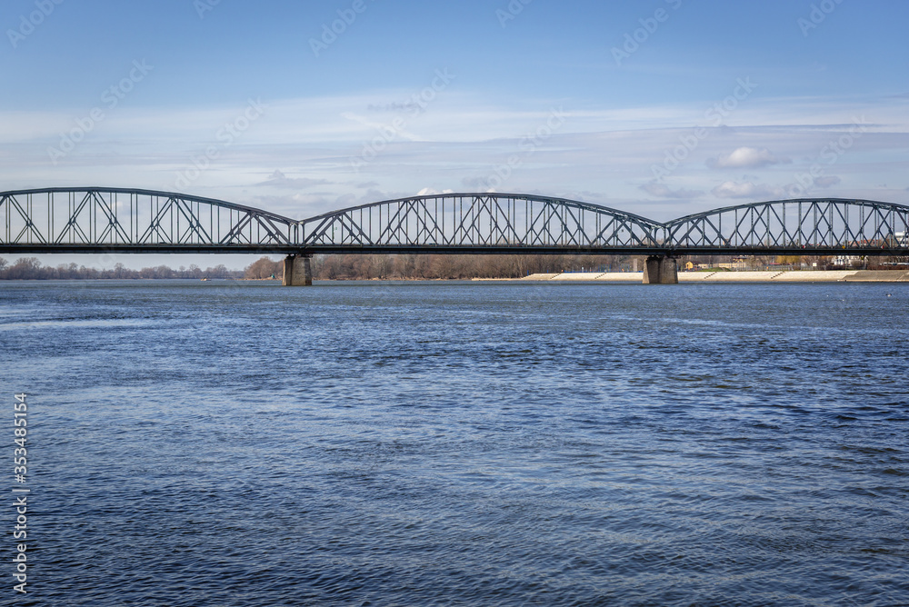 Fototapeta premium River Vistula with bridge of Josef Pilusdski in Torun city, Poland