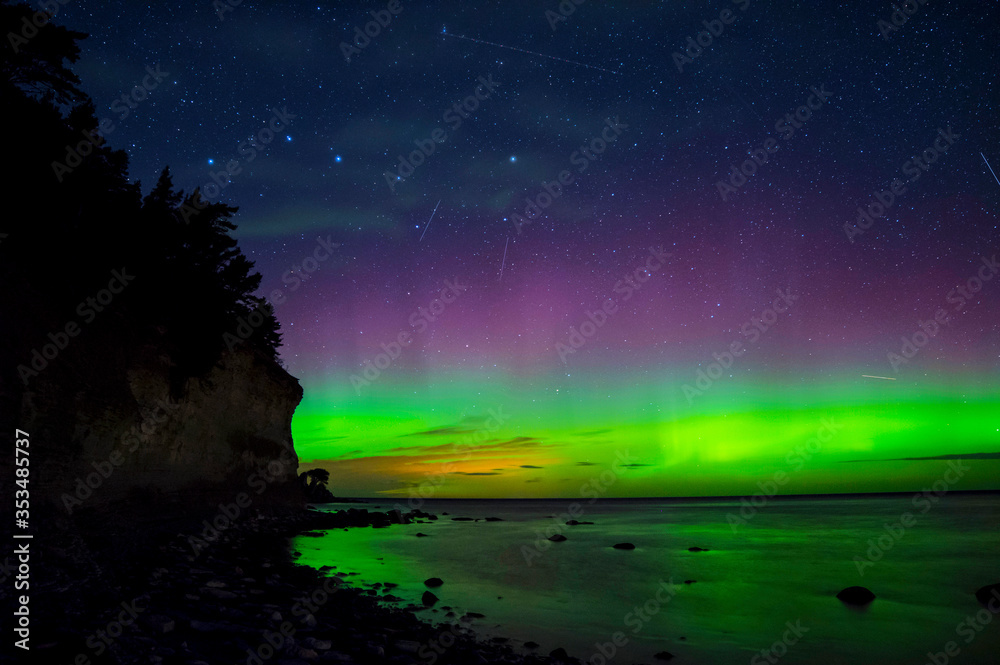 Aurora Boralis showing its beauty over the Baltic sea on an clear winter night outside the island of Gotland in Sweden