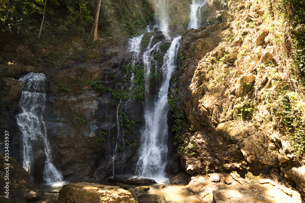 Obraz premium High waterfall in the rainforest on the island of Mindoro in Philippines