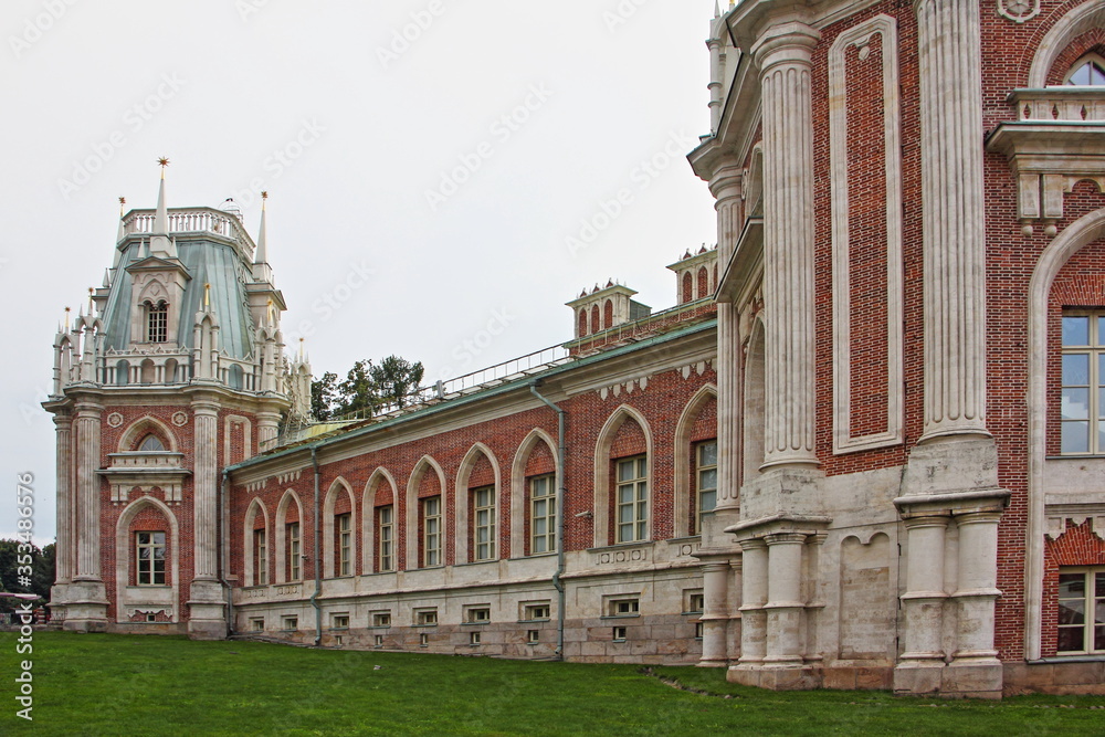 Moscow / Russia – 07 16 2019: Grand Palace buildings front wall with arch windows in Tsaritsyno Park Museum on summer day, architecture ancient famous landmark, close up view
