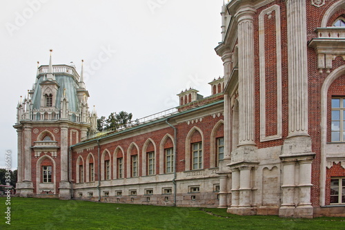 Moscow / Russia – 07 16 2019: Grand Palace buildings front wall with arch windows in Tsaritsyno Park Museum on summer day, architecture ancient famous landmark, close up view