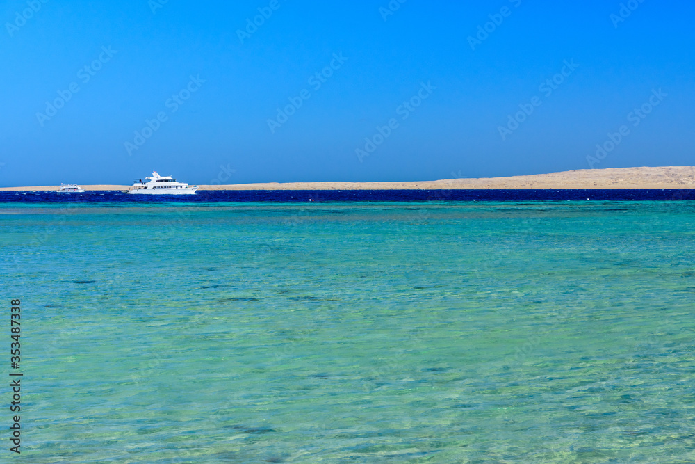 White yacht in Red sea not far from the Hurghada city, Egypt White yacht in Red sea not far from the Hurghada city, Egypt