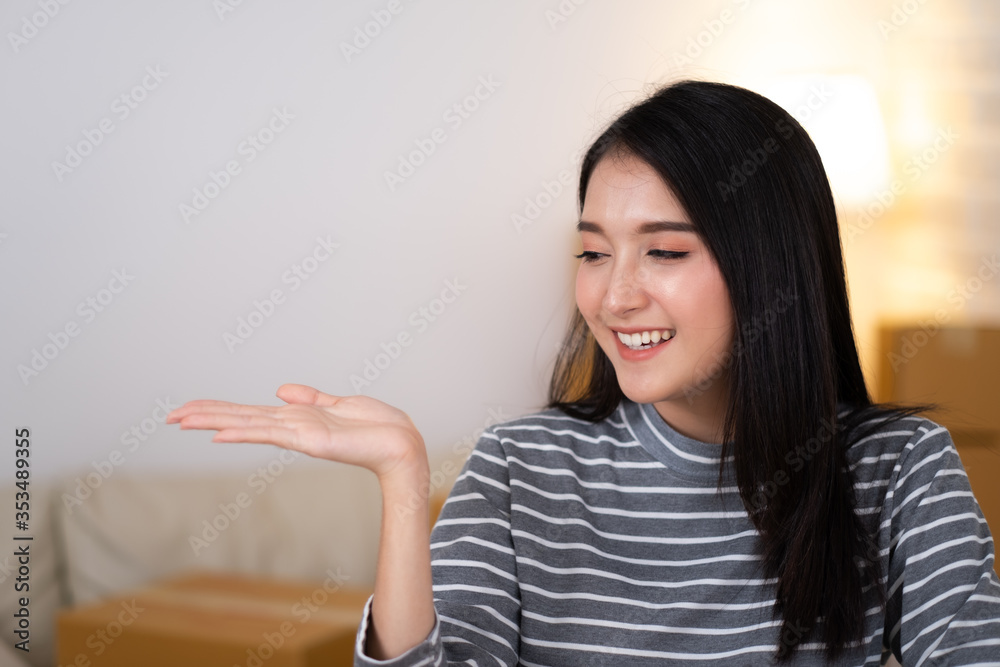 Beauty Asian woman smiling and open the palm of the hand. Beauty Asian woman smiling and open the palm of the hand.