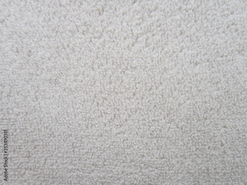 Gently beige color synthetic fabric.