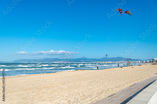 PALMA DE MALLORCA, SPAIN - MAY 11 2020 : Kite Surfer at the Playa de Palma  at  - Mallorca during Corona Lock down  on May 11, 2020 in Palma de Mallorca, .