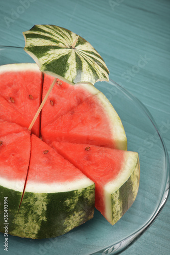 Watermelon And umbrella in blue background 