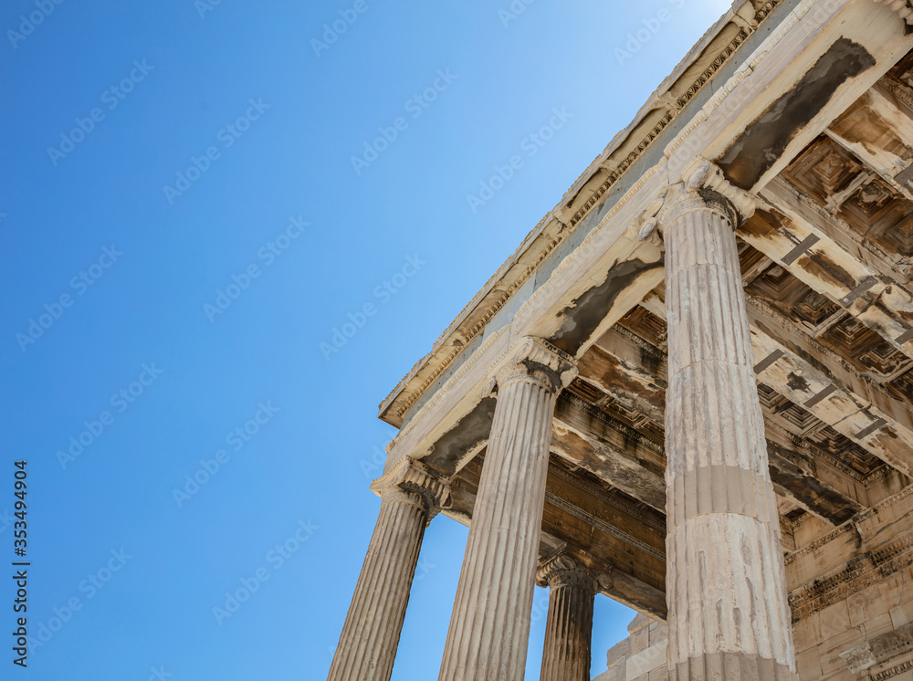 Athens, Greece. Erechtheion Temple of Athena on Acropolis hill, blue sky background