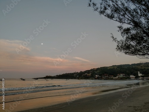 sunset with moon at the beach