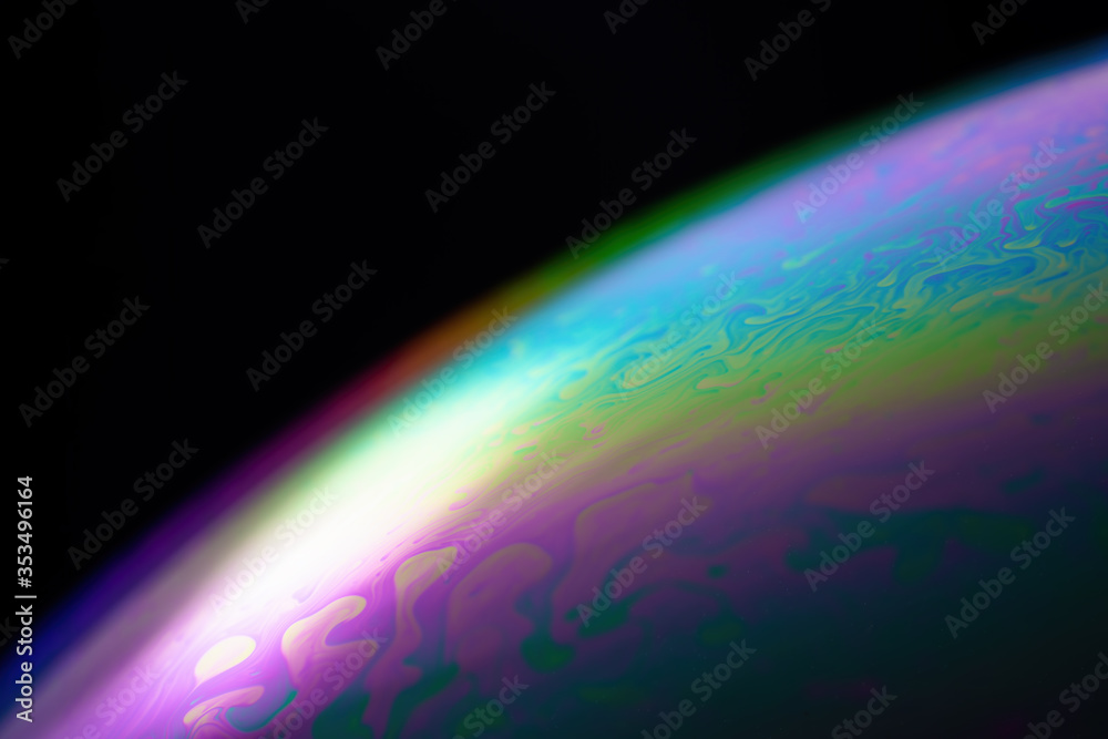Abstract wave background shimmering on the surface of a sphere. Soap bubble texture