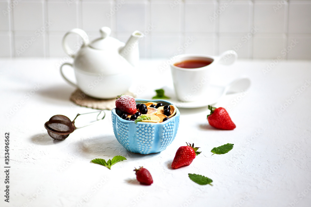 Mini-pancakes, Tiny pancakes, trendy food.
Fritters with fruit: blackcurrant, strawberry, mint. Breakfast with tea Mini-pancakes, Tiny pancakes, trendy food.
Fritters with fruit: blackcurrant, strawberry, mint. Breakfast with tea
