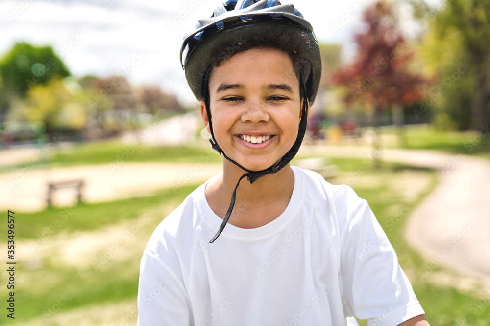 boy riding bike wearing a helmet outside boy riding bike wearing a helmet outside