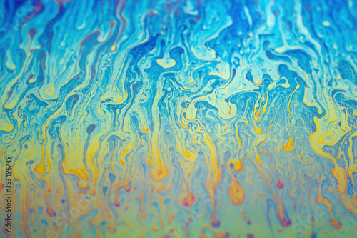 iridescent rainbow on the surface of a soap bubble sphere. Colorful background insane colors psychedelic