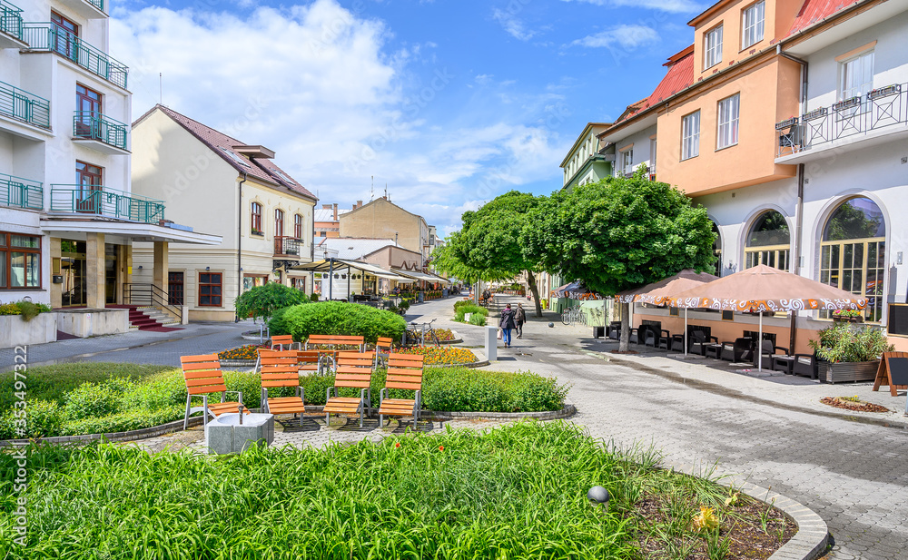Wooden seats with a lot of green in Pedestrian zone in centre of spa town Piestany (SLOVAKIA)