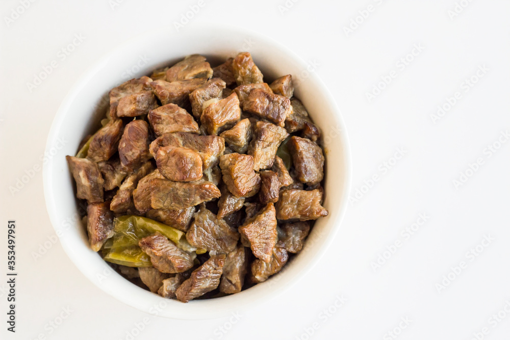 Traditional Turkish Food,Braised Beef Meat in the white color bowl.The Sacrifice Feast Concept of Islam. Traditional Turkish Food,Braised Beef Meat in the white color bowl.The Sacrifice Feast Concept of Islam.