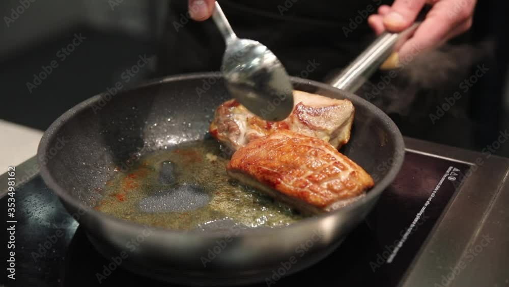 meat is fried in a pan on an electric stove meat is fried in a pan on an electric stove