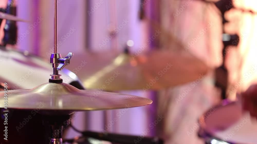 The drummer is drumming in the Studio. Playing drums on Hi-hat. Static video shooting. Close up.