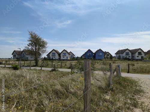 View of National park in North Germany with vacation home, dunes and path