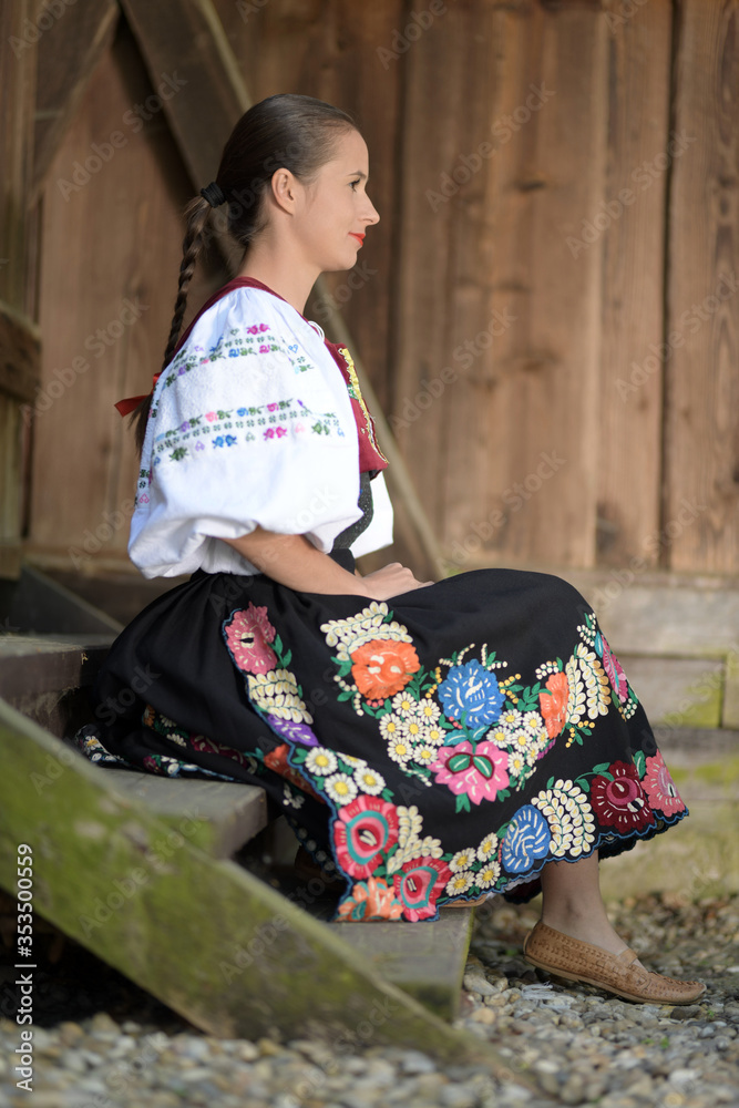 Young beautiful slovak woman in traditional costume. Slovak folklore.