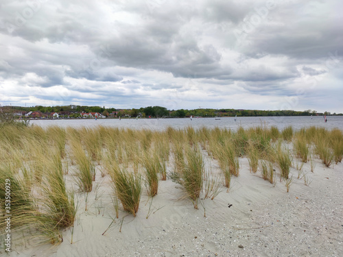 Fototapeta Naklejka Na Ścianę i Meble -  Photo of dunes and white sand beach at Baltic sea