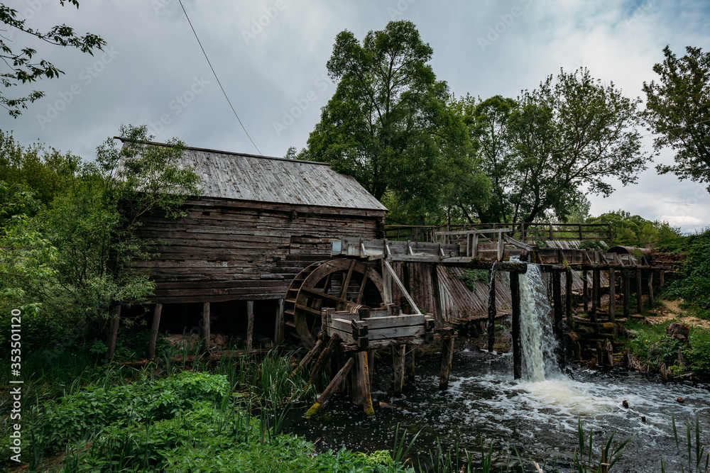 Old wooden log watermill in Russian village Old wooden log watermill in Russian village