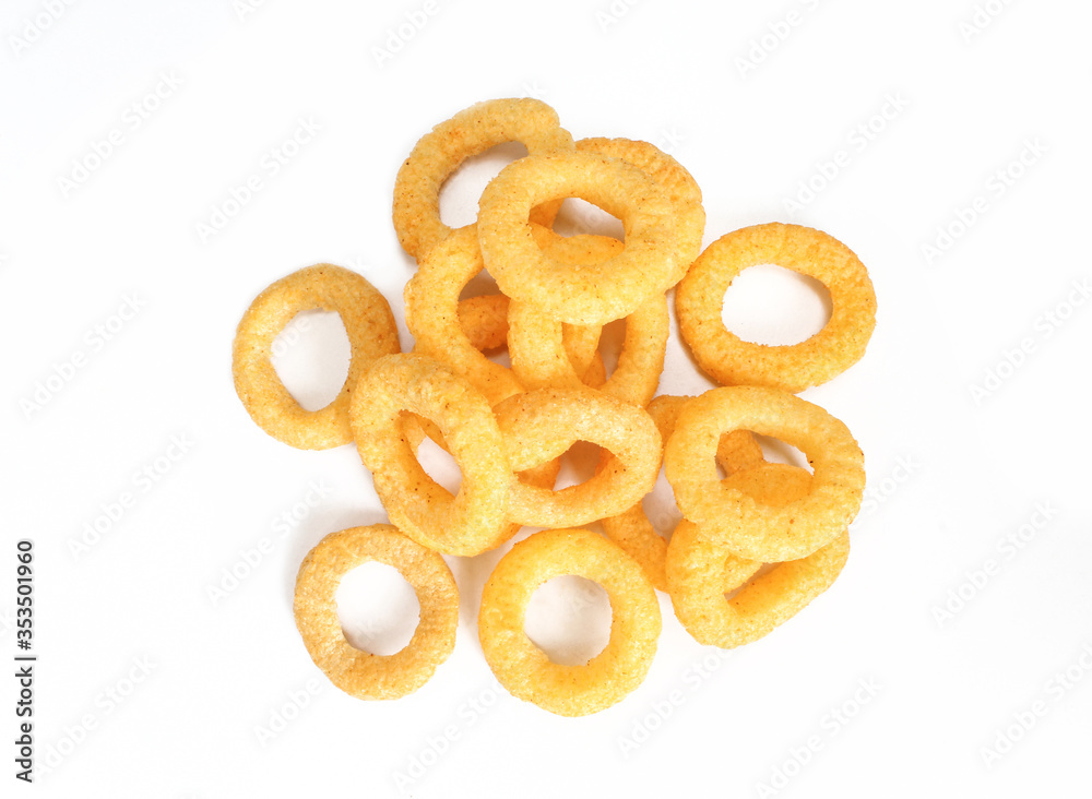 Delicious ring snacks isolated on white background. Pile of yellow unhealthy junk food