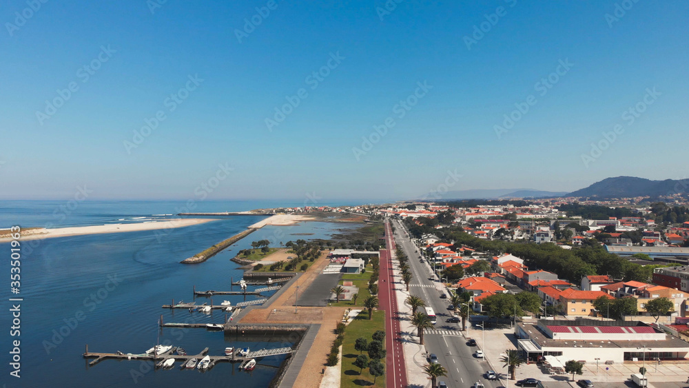 Aerial view of palm trees promenade and cycle path, Esposende, The marginal riverside, along the mouth of the Cavado River in Esposende, Portugal.