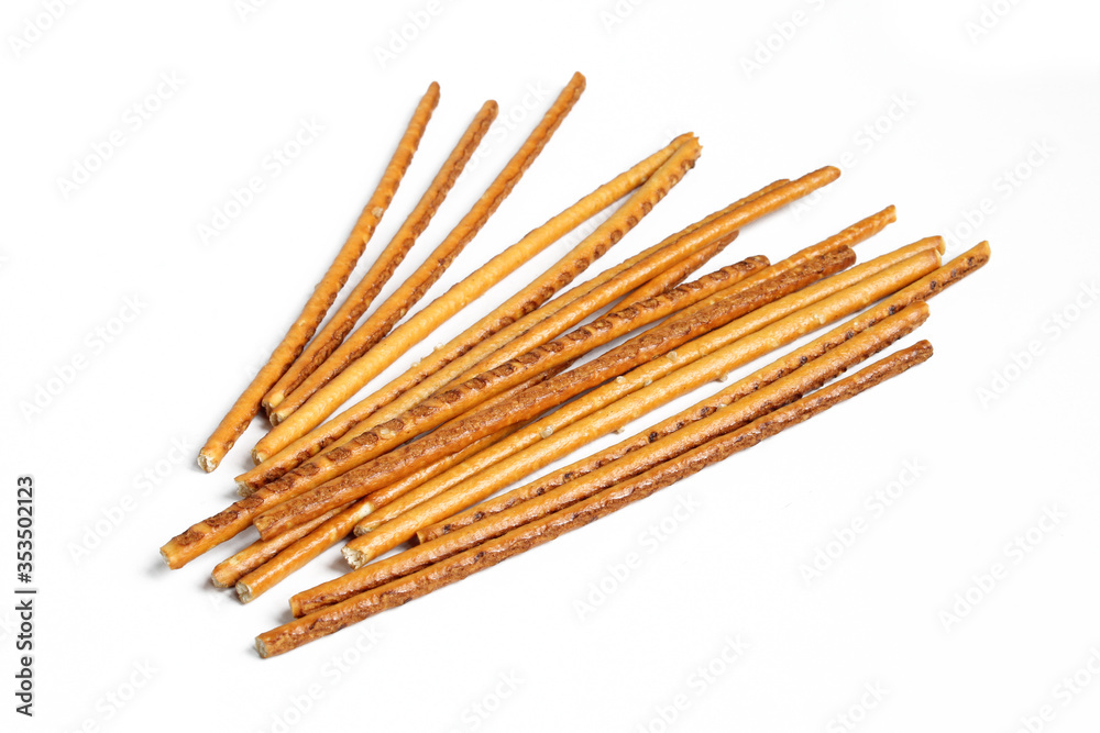 Pile of pretzel sticks isolated on white background. Salty snacks