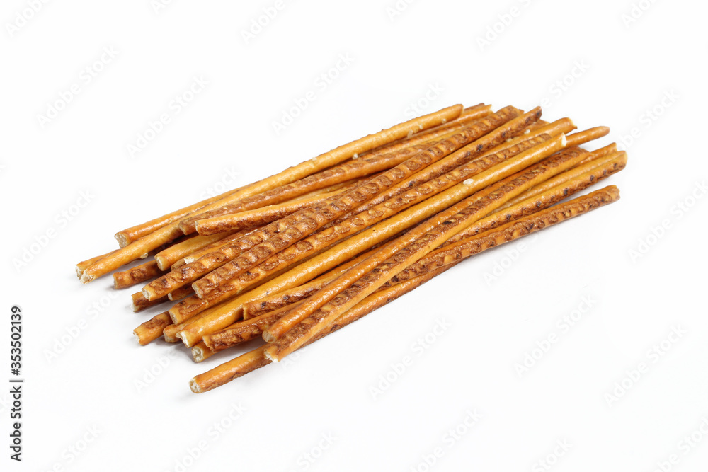 Pile of pretzel sticks isolated on white background. Salty snacks