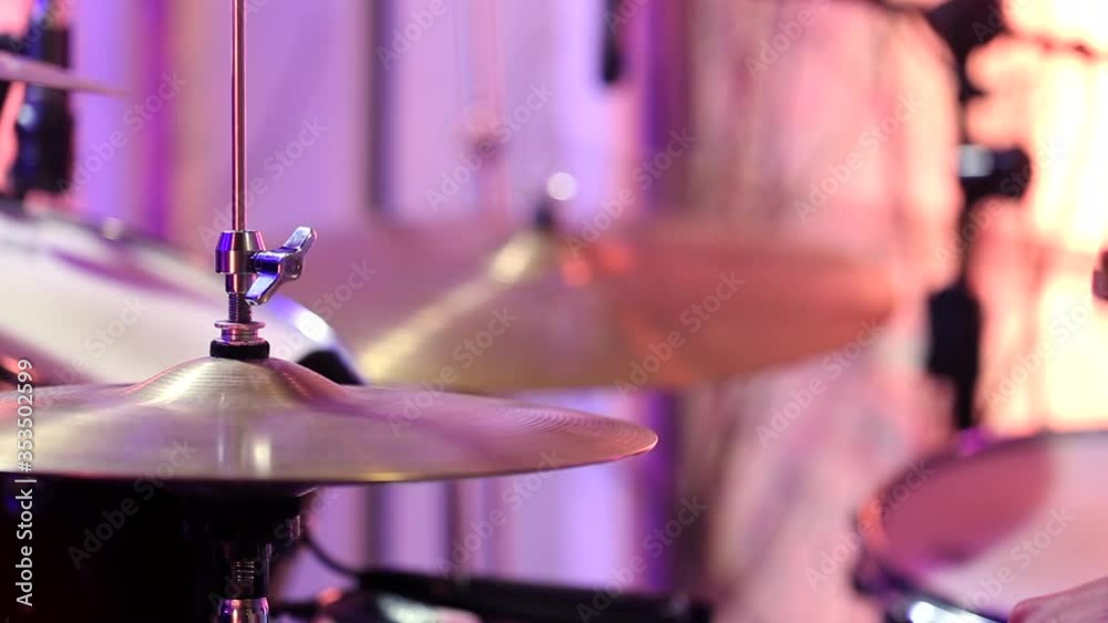 The drummer is drumming in the Studio. Playing drums on Hi-hat. Static video shooting. Close up. The drummer is drumming in the Studio. Playing drums on Hi-hat. Static video shooting. Close up.