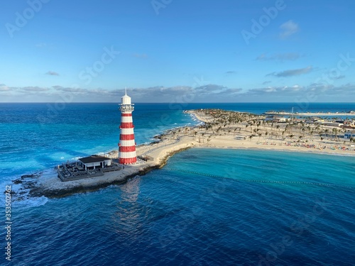 lighthouse on the beach © Mirza.C
