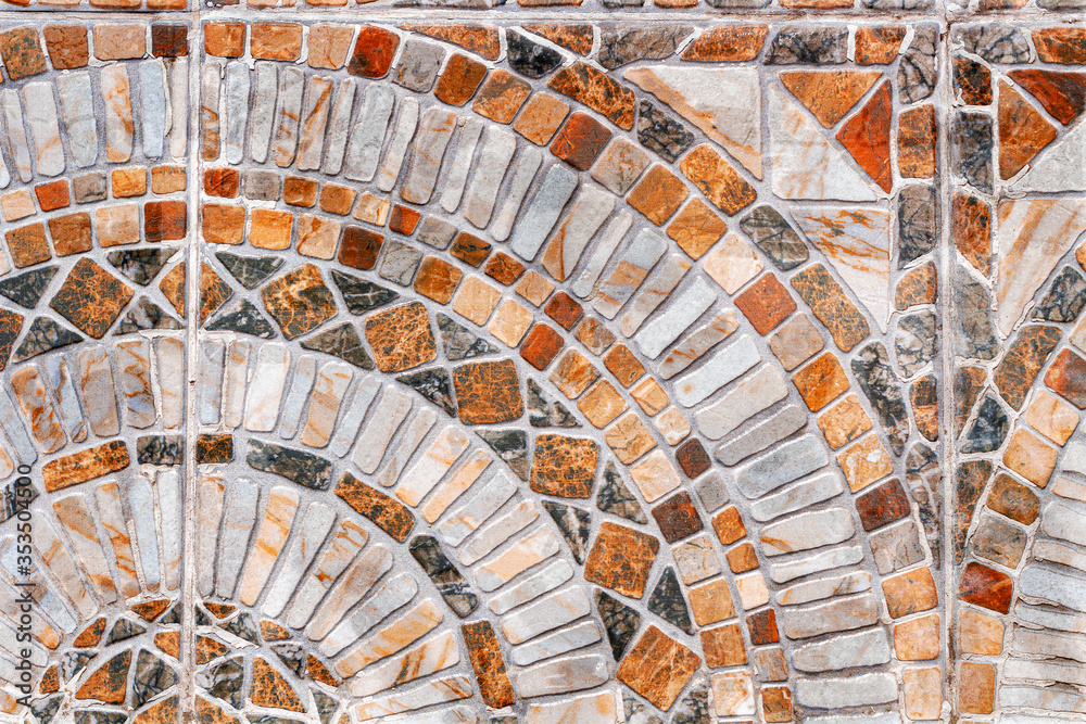 Stone mosaic texture. Abstract outdoor tile. Geometry design with squares and rounds. Natural material background