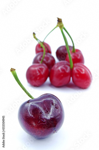 Organic cherries on white background   