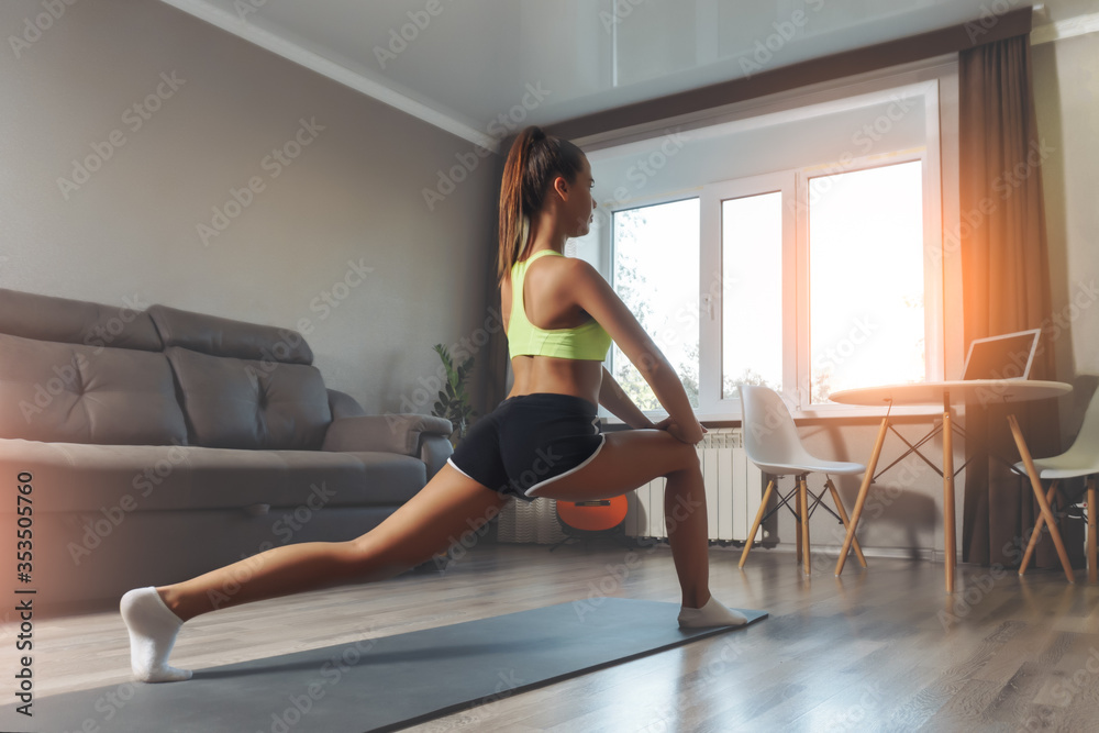 Young caucasian woman Stretching on yoga mat at home. Workout at home concept. Young caucasian woman Stretching on yoga mat at home. Workout at home concept.
