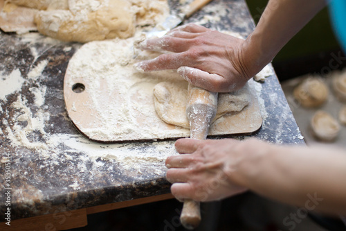 Close up Image of Rolling Pin and Dough