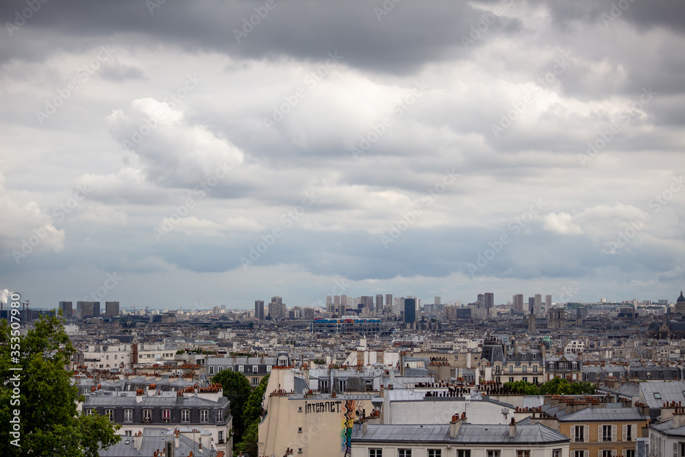 Cityscape of houses in Paris going into the distance on a cloudy day