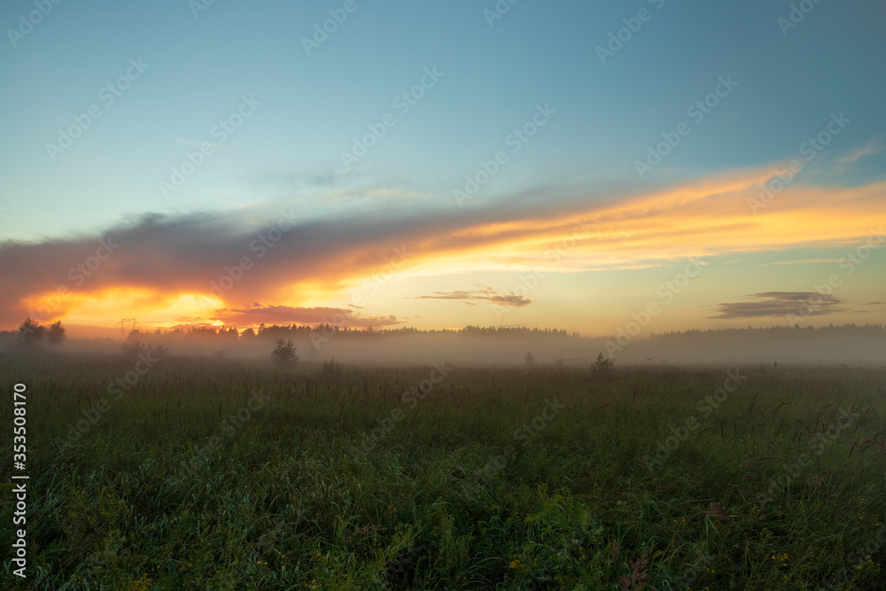 Landscape On Meadow With Fog Under Cloud With Sunset In Evening.