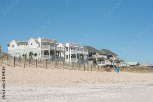 Oceanfront property along the shore of a nearly deserted Wrightsville Beach