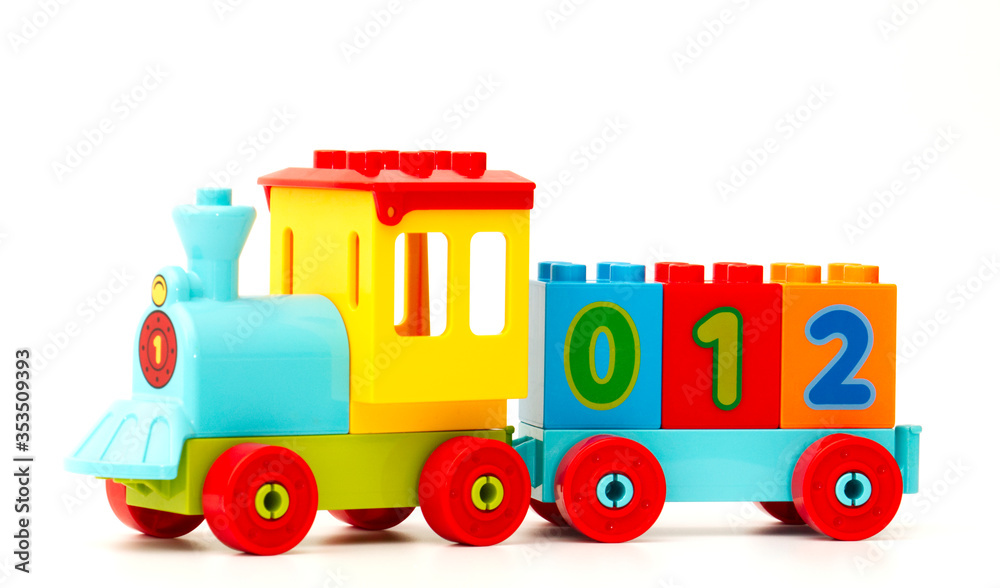 Kids plastic colorful toy train with numbers on the white backround. Kids plastic colorful toy train with numbers on the white backround.