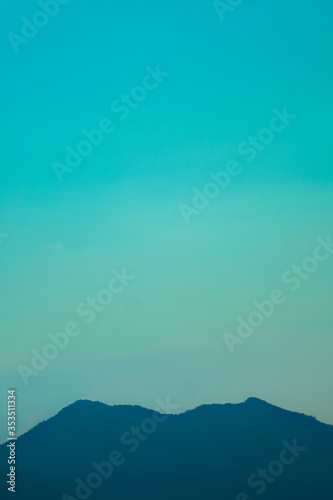 Clear teal sky above plateau 